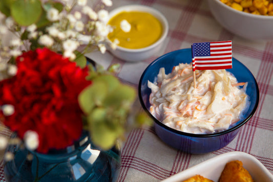 A table displaying a bowl of food alongside a small American flag
