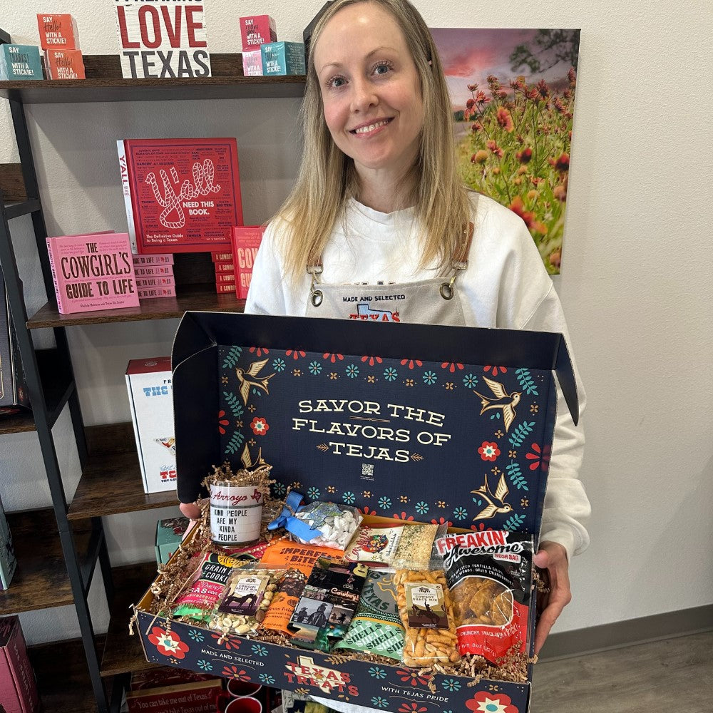 Owner of Texas Treats, Rachel, holding a custom-made Tejas box.