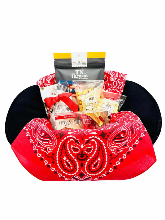 Texas Treats' Cowboy Hat gift basket, packed inside of a black cowboy hat with a red bandana.